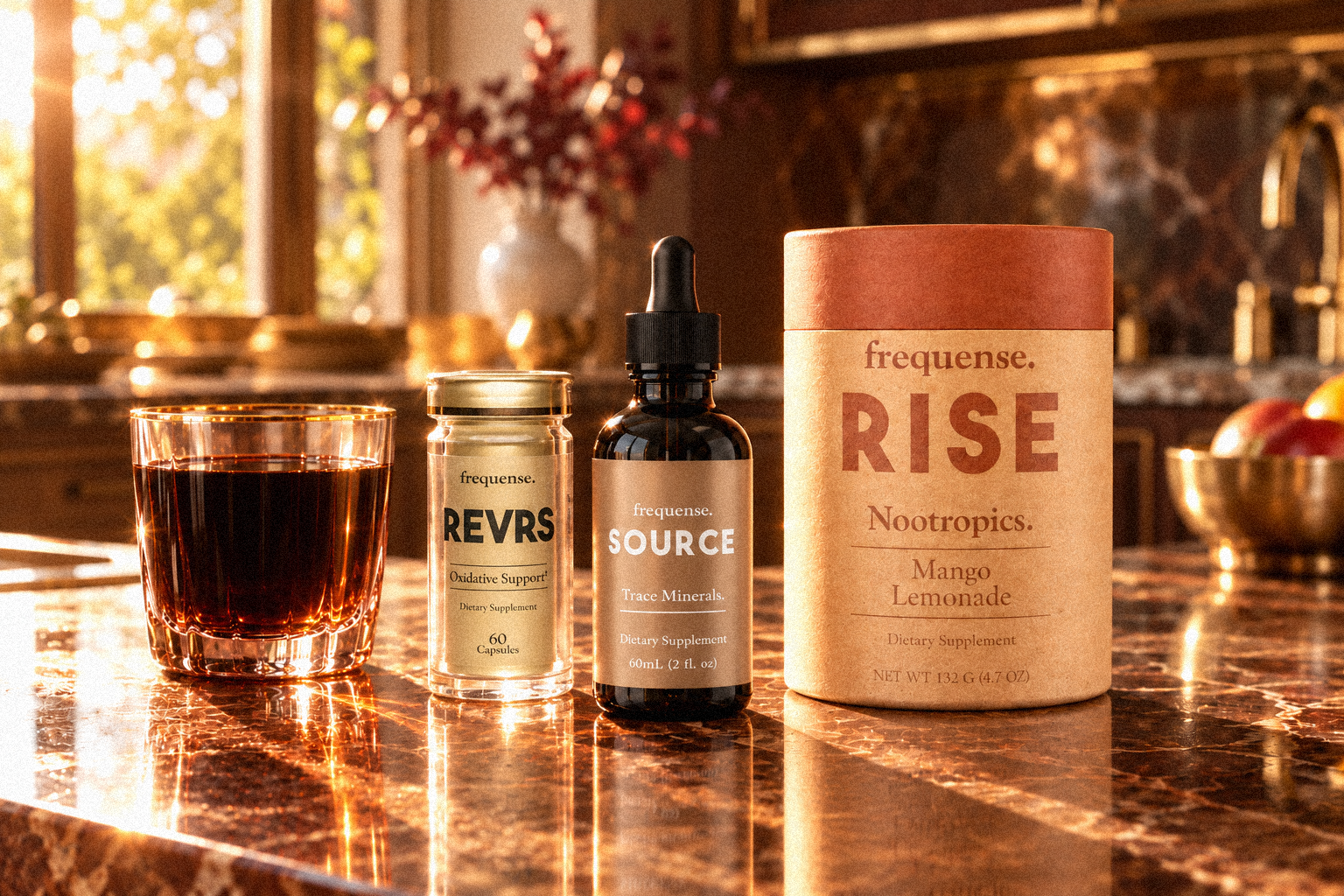 REVRS, SOURCE and RISE on a kitchen counter beside a morning glass